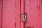 Padlock on wooden red color entrance door, Traditional house facade, old town of Plaka, Athens Greece