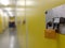 A padlocked storage unit door along a corridor