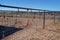 Padlocks, love locks, and keychains on a wire fence in the desert