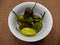 Padron Chilli peppers on a white bowl
