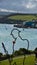 Padstow Harbour viewed from the War Memorial in the park, where a soldierâ€™s silhouette and outline guards the entrance on the Ri