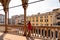 Padua -  Tourist woman enjoying the view on Piazza delle Erbe from the loggia of Palazzo della Ragione in Padua, Veneto, Italy