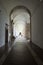 PADULA, ITALY - AUGUST 22th 2018: Tourists visit the cloister hallway of Certosa di San Lorenzo, a Cartusian abbey close to