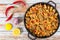 Paella with meat, pepper, vegetables and spices