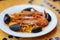 Paella. Rice with king prawns and mussels