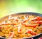 Paella. Traditional spanish food, seafood paella in the fry pan with mussels, king prawns, langoustine and squids. Cooking paella