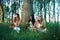 Pagan Girls in the forest by the tree