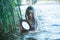 Pagan rituals in lake, young woman in white