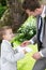 Page Boy Handing Wedding Ring To Groom