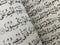 page on the contents of the Koran with Arabic writing with a blur effect