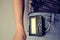 Pager hanging from man jeans belt, retro gadget for communication