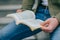 Pages of Education Close-Up of Hands Reading a Book