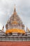 Pagoda with golden emblem Chaiya Relic temple,