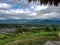 Pai palm leafes viewpoint small houses blue roof village background mountains hills north chiang mai thailand asia view