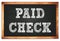 PAID CHECK words on black wooden frame school blackboard