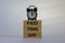Paid time off symbol. Wood blocks with words `paid time off` on a beautiful white background. Black alarm clock. Business and pa
