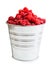 A pail full of freshly picked raspberry