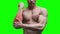 Pain in the elbow, muscular male body on green background, chroma key 4K video