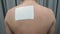 Pain Relief Patch or plaster on man`s Back From Japan