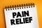 Pain Relief text on notepad, medical concept background