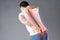 Pain in the spine, a man with backache, injury in the human back, chiropractic treatments concept