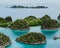 Painemo, Group of small island in shallow blue lagoon water, Raja Ampat, West Papua, Indonesia