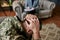 Painful life. Close up of military man holding his head in pain and depression during therapy session with psychologist