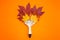 Paint brush with dry bright autumn leaves concept