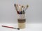 Paint brushes in support. Luxurious glass full of different brushes