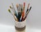 Paint brushes in support. Luxurious glass full of different brushes