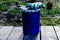 Paint can lying on the terrace of a private house with a brush and gloves, ready to be opened and painted. home repair and mainten