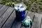 Paint can lying on the terrace of a private house with a brush and gloves, ready to be opened and painted. home repair and mainten