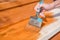 Paint the porch with orange paint. Decorate the terrace. Paint the boards with a wide brush. To make repairs