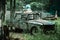 Paintball shooting range. Paintball territory in the forest. Old car. Art editing