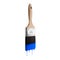 Paintbrush loaded with blue color dripping off the bristles.