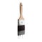 Paintbrush loaded with gray color dripping off the bristles.