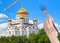 Paintbrush paints blue sky over russian cathedral