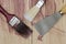 Paintbrush tools on wooden background
