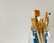 Paintbrushes in a glass jar isolated on grey background.