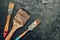 Paintbrushes on metal surface. Old brush set for house maintenance. Technical background