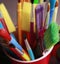 Paintbrushes in plastic cup