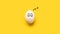 Painted chicken egg with sleeping smiley on yellow