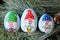 Painted Christmas Gnome Kindness Rocks on Evergreen Tree Branch