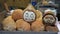 Painted coconuts with faces, Lijiang