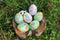 Painted Easter eggs hidden on the grass, ready for the easter egg hunt traditional play game