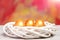 Painted easter golden eggs in bird nest on colorful background