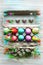 Painted eggs in egg tray. Glitch effect. Spring holiday. Holiday celebration, preparation. Egg hunt. Flower. Healthy and happy