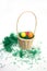 Painted eggs in wooden basked filled with green grass