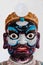 Painted face of antique Chinese ship ballast stone warrior ceramic doll in Wat Ratchaorasaram temple, Bangkok