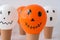 Painted Jacks face on balloons. Orange and white balls preparation diy for halloween party. Halloween home activities